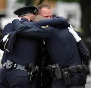 police officer sandy hook elementary support officers peer law enforcement newtown ct children stress hugging shooting school responders ptsd emotional